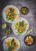 Tortillas with hummus, asparagus, olives and halloumi cheese