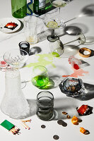 Leftovers and fallen glasses on the table after a game night