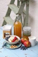 Natural Remedies; Essential Oil Warmer, Homemade Rosemary Vinegar and a Bowl of Muesli with Fruit