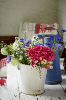 Colorful bouquet of flowers in vintage bucket