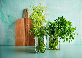 Dill and parsley in jars