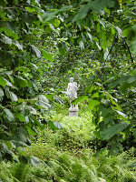 Sculpture in a lush garden