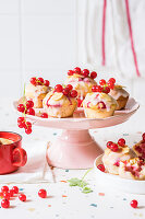 Redcurrant cupcakes with sugar glaze and toasted almond flakes