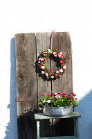 Wreath and Easter nest made out of bellis in metal pot