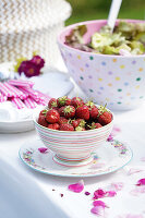 Leaf salad and fresh strawberries