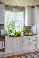Rural kitchen with white cupboard fronts