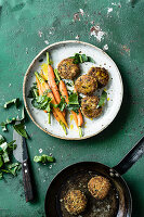 Young carrots with green spelt fritters