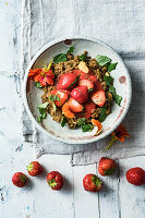 Amaranth and coconut porridge with strawberries