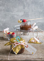 Chocolate fondue in a glass with fruit