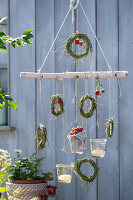 DIY mobile with grasses, strawberries and lanterns