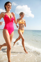 Friends jogging on the beach