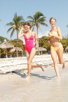 Friends jogging on the beach