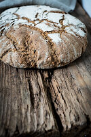 Loaf of bread on wooden background