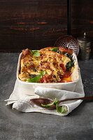 Mushroom ravioli casserole with spinach, ricotta and tomato sauce