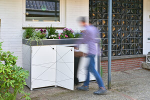 DIY box for the rubbish bins, with plants on top