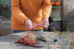 Heart of rose hips on a bent wire wreath blank