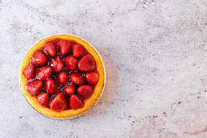 Baked cheesecake with glazed strawberry topping