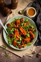 Salad of butternut squash, chickpeas, sun-dried tomatoes, and rocket