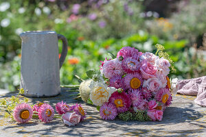 Bouquet with roses and strawflowers