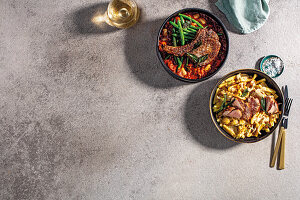 Masala pork chop on relish and creamy mushroom noodles with pork tenderloin