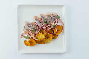 Maatjes herring with fried potatoes