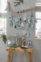 DIY advent calendar with fabric bags on a branch