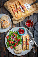 Sausages with cheese and bacon with tomato lamb's lettuce
