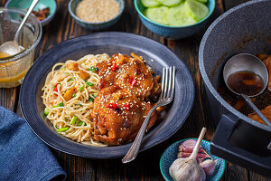 Chicken braised in honey soy sauce with Indonesian noodles