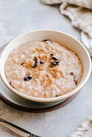 Creamy rice pudding with golden raisins and cinnamon