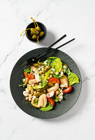 Tuna salad with chickpeas and caper berries