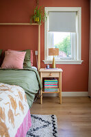 Bedroom with wall in terracotta