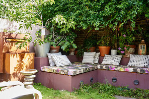 Secluded seating area and water feature in a small courtyard