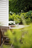 Wooden table with chairs on the terrace