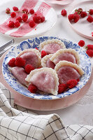 Sweet dumplings with raspberries