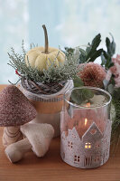 Autumn decoration with felt mushrooms, felt covered candle lantern, pumpkin and dahlias