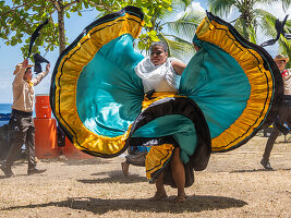 A group of young Costa Rican dancers in traditional dress perform at Playa Blanca, El Golfito, Costa Rica, Central America\n