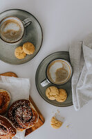 Coffee with freshly baked cookies on table\n