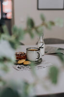 Coffee with freshly baked cookies and pastry on table\n
