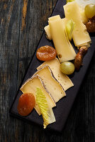 A cheese platter with dried fruits