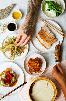 Chinese menu with pork belly, PEking duck, lotus flowers and tempura