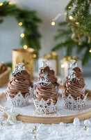Christmas cupcakes with chocolate cream topping