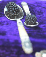 Blackberries on silver spoon