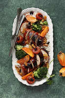 Roasted chicken thighs with broccoli, persimmon and dried fruit