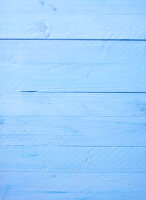 Light blue wooden background