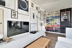 Modern living room with bookshelf and pictures
