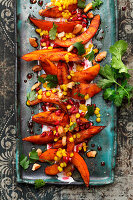 Grilled pumpkin wedges with lentil and pomegranate vinaigrette