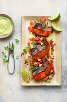 Salmon trout teriyaki with watermelon and cucumber relish and wasabi lime mayo