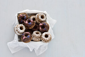 Vegan mini almond bundt cakes with chocolate icing and icing sugar