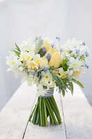 Spring bouquet with daffodils, tulips, grape hyacinths and forget-me-nots