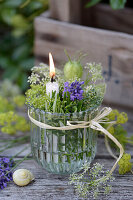 Small lantern filled with rosemary, thyme, nigella and meadow chervil